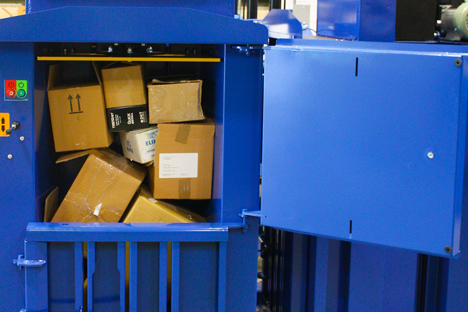 the bale chamber full of cardboard boxes ready to be compacted.