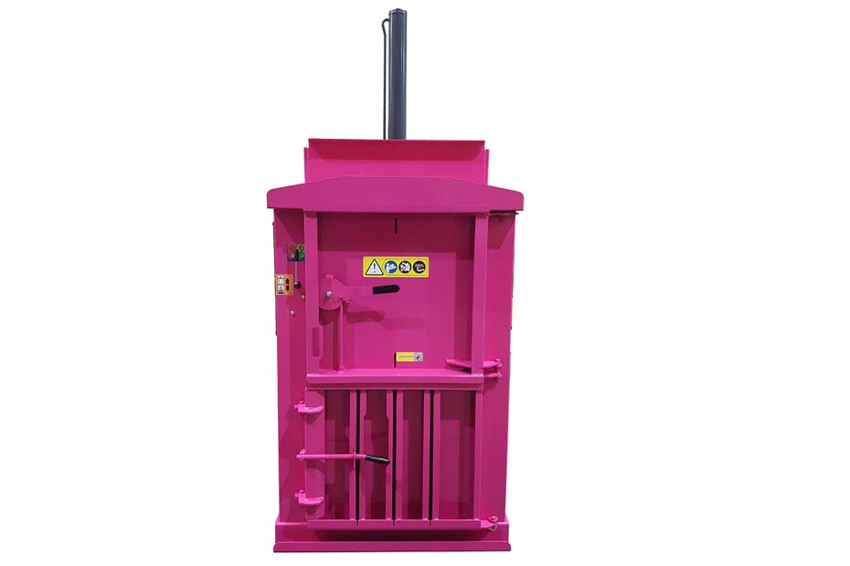 a MACFAB 75 cardboard baler in pink.  